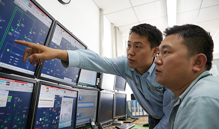 people looking at monitors image people looking at monitors image