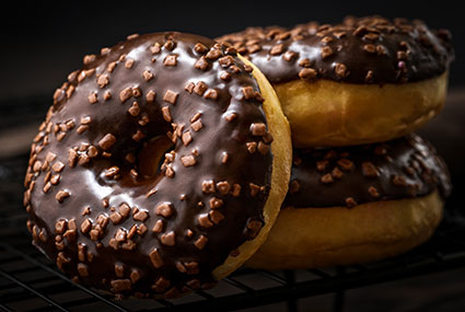Chocolate coating on a doughnut Chocolate coating on a doughnut