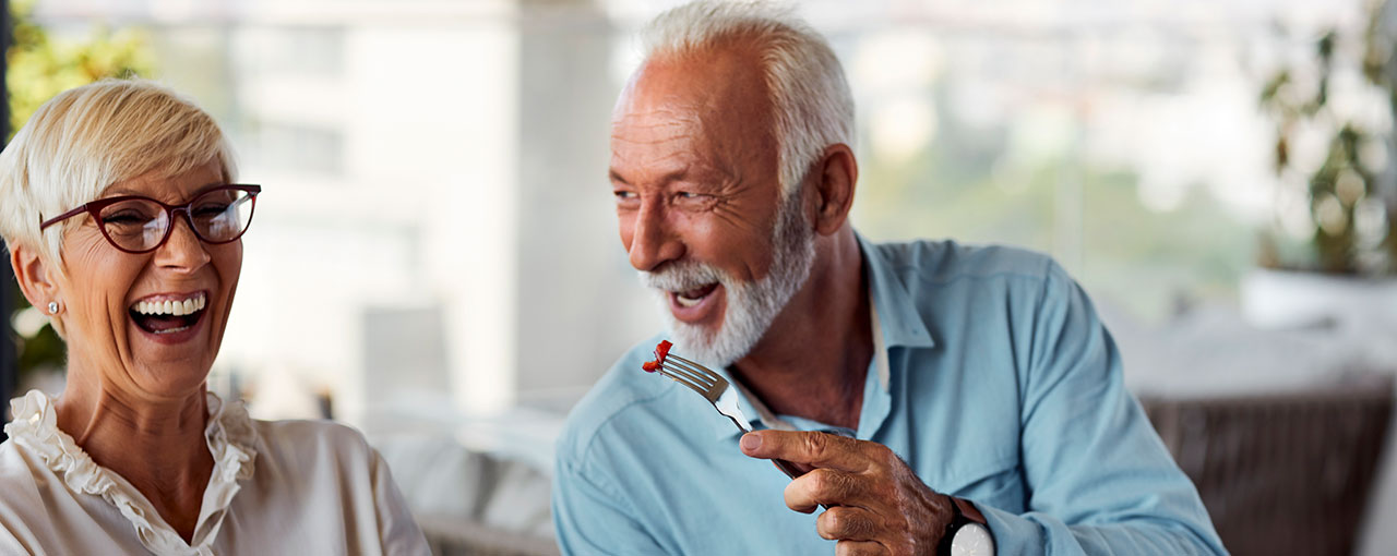Senior Couple Having Breakfast in Restaurant