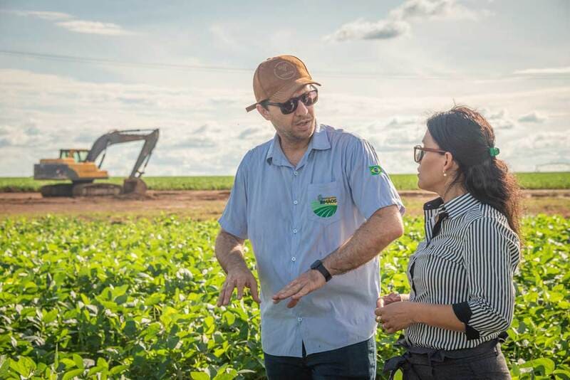 farmers walking around a field image farmers walking around a field image