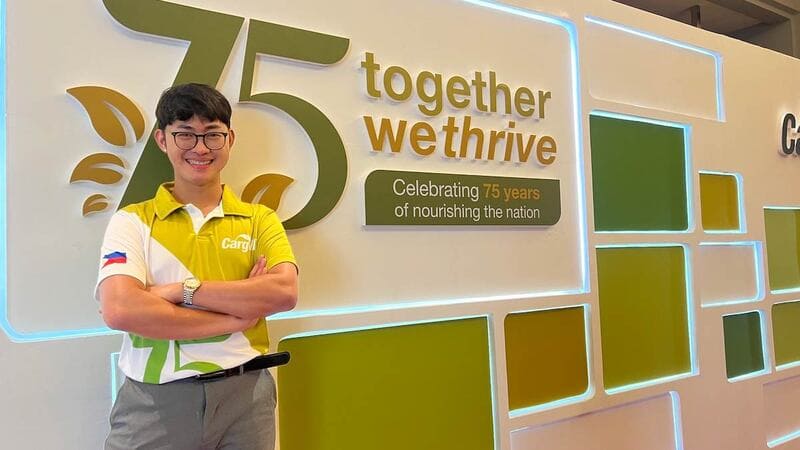Mark Eugene, a plant manager at Cargill’s poultry facility in Calabarzon, Philippines, stands in front of a feature wall at a Cargill location.  Mark Eugene, a plant manager at Cargill’s poultry facility in Calabarzon, Philippines, stands in front of a feature wall at a Cargill location.