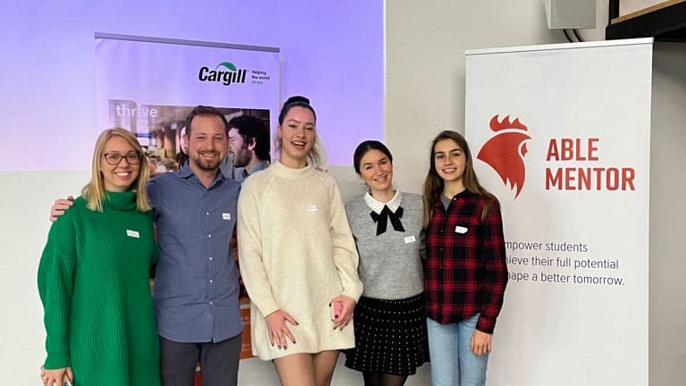 Five colleagues smile during a mentorship event in Bulgaria.  Five colleagues smile during a mentorship event in Bulgaria.