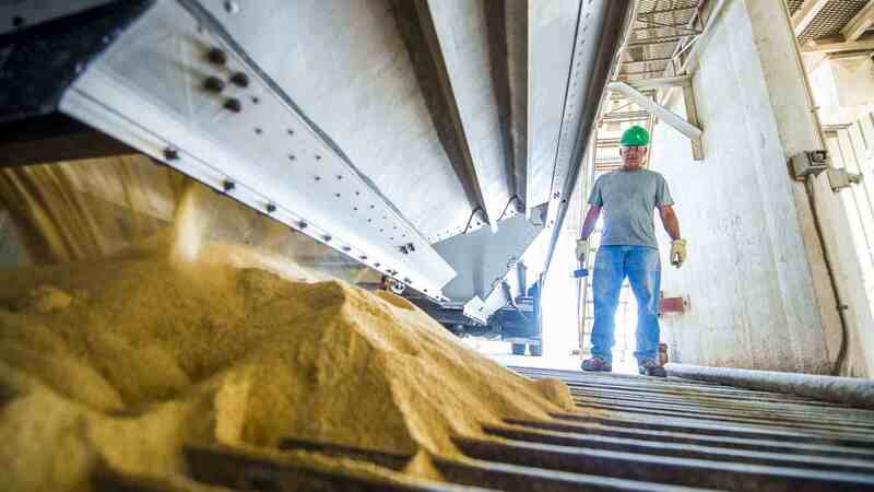 A Cargill employee in an animal feed production facility. A Cargill employee in an animal feed production facility.