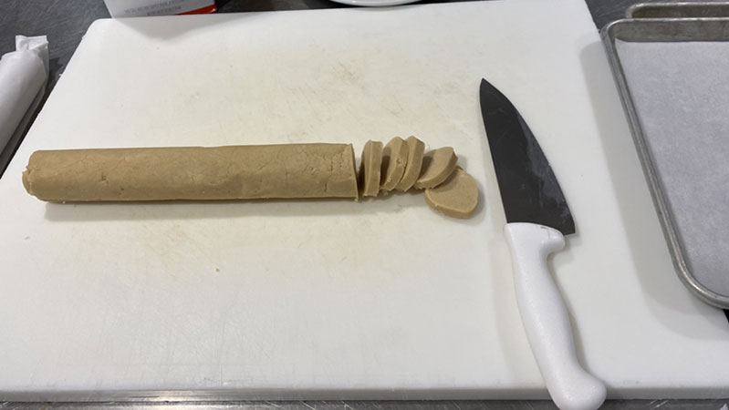 Dough rounded into a log.  Dough rounded into a log.