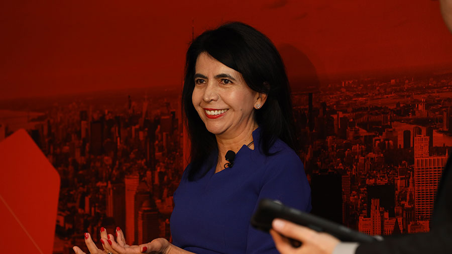 Pilar Cruz smiles while speaking at a Climate Week panel on resilient food system.  Pilar Cruz smiles while speaking at a Climate Week panel on resilient food system.
